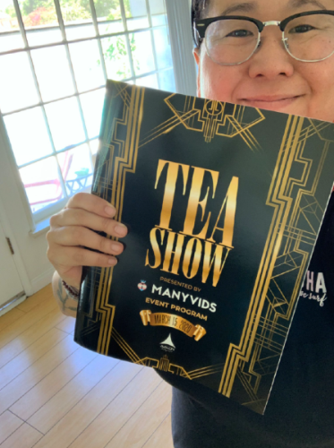 Kristel Penn wields a 2020 TEAs program printed with the ceremony's original date